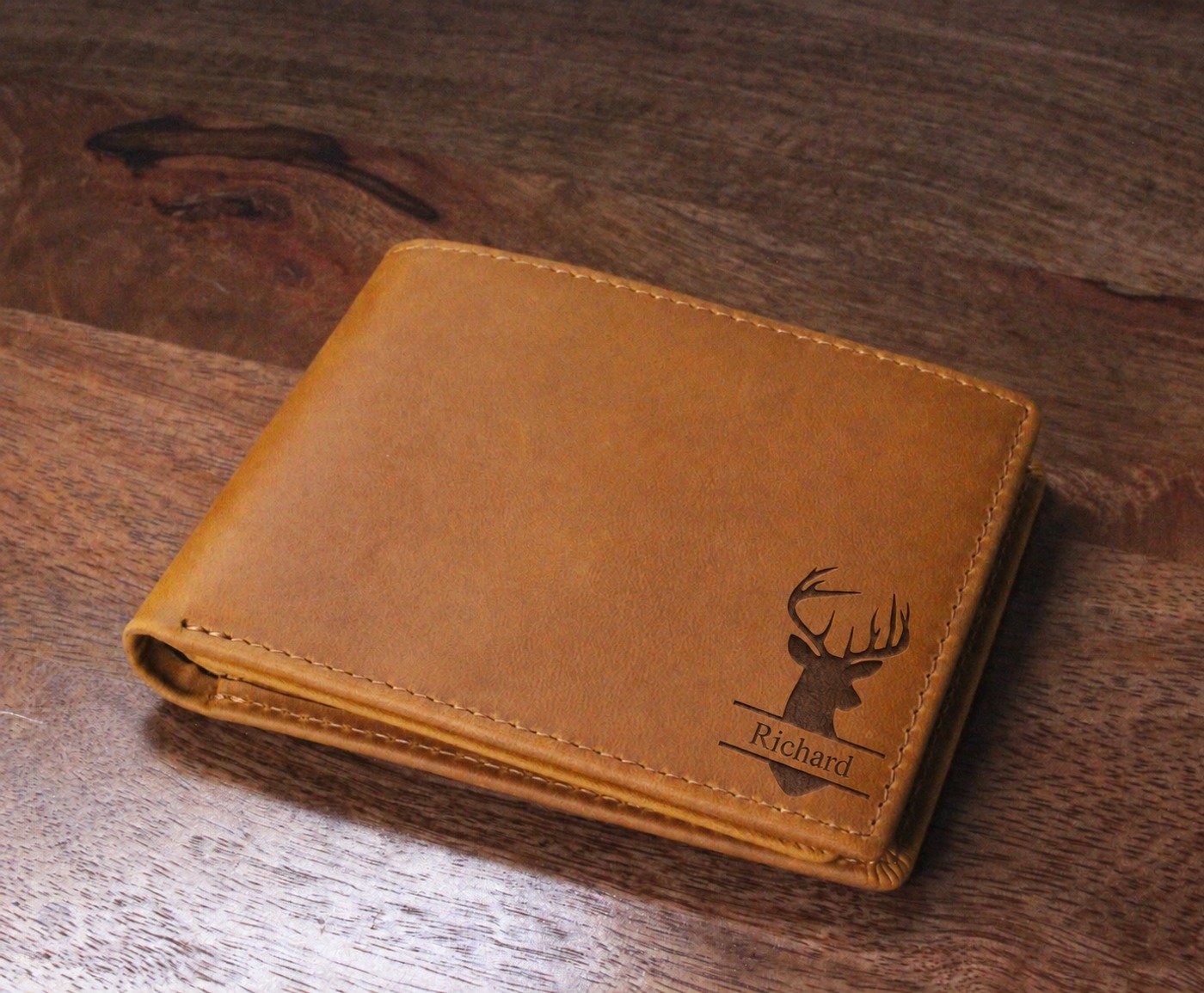 Saddle-tan wallet personalized with a deer design and the name Richard