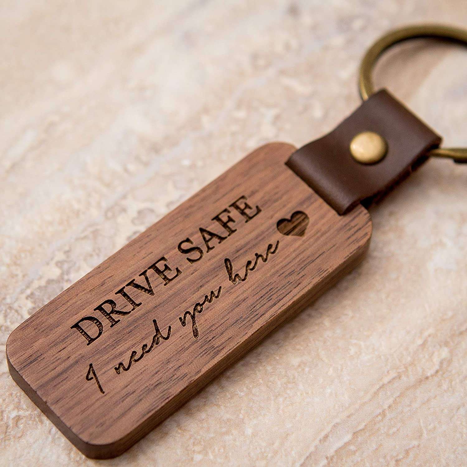 Wooden keychain engraved with a caring message